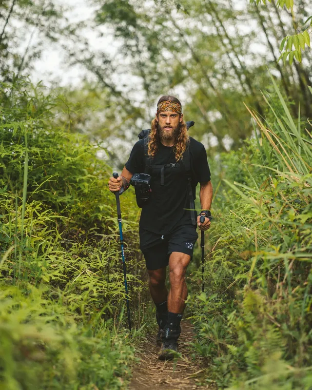 Jackson Groves hiking a jungle trail