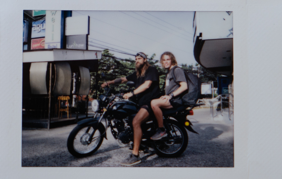a couple of people that are sitting on a motorcycle.