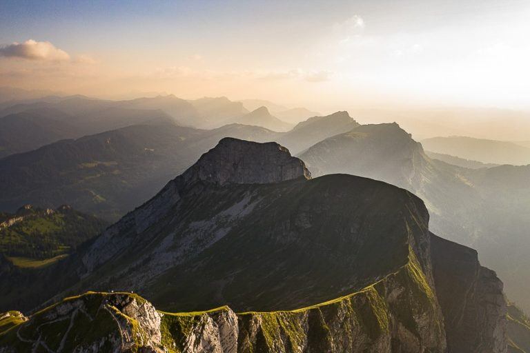 a person standing on top of a mountain.