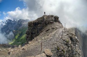a person standing on top of a mountain.