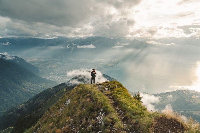 a person standing on top of a mountain.