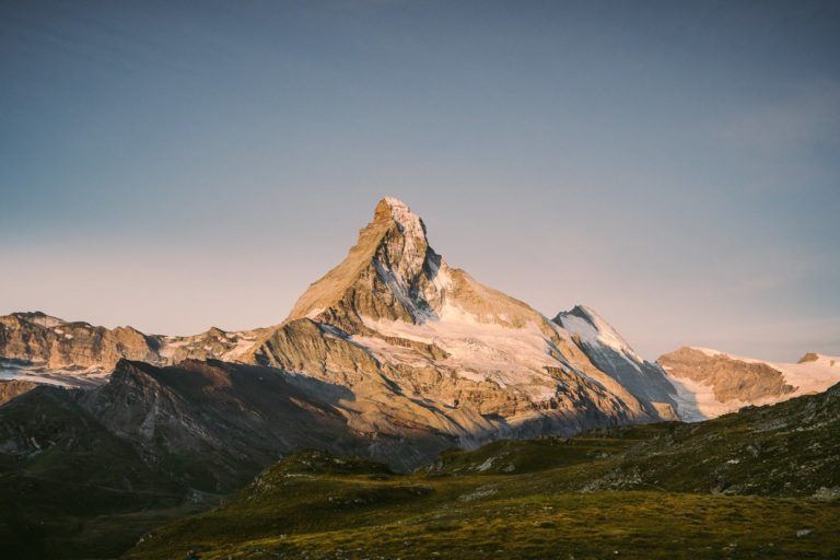 a mountain with a snow covered peak in the distance.