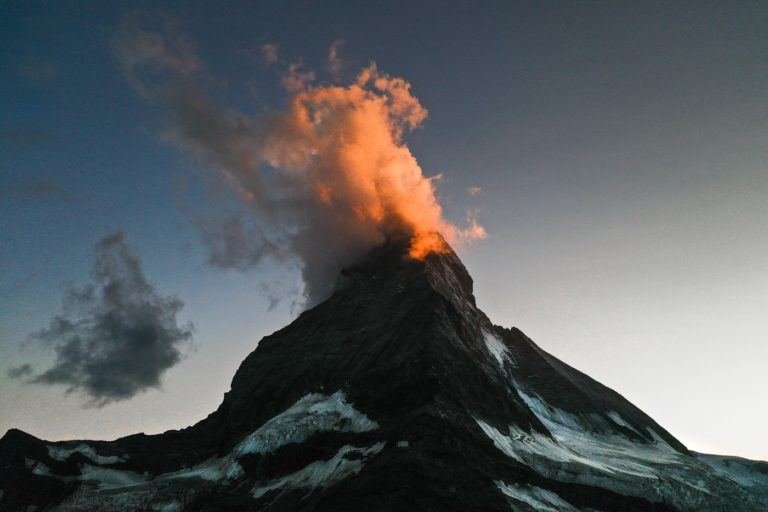 a mountain with a cloud of smoke coming out of it.