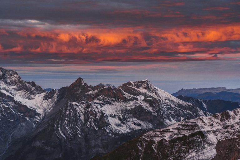 a view of a mountain range at sunset.