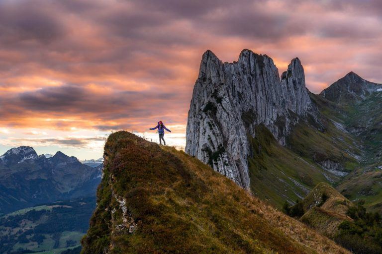 a person standing on top of a mountain.