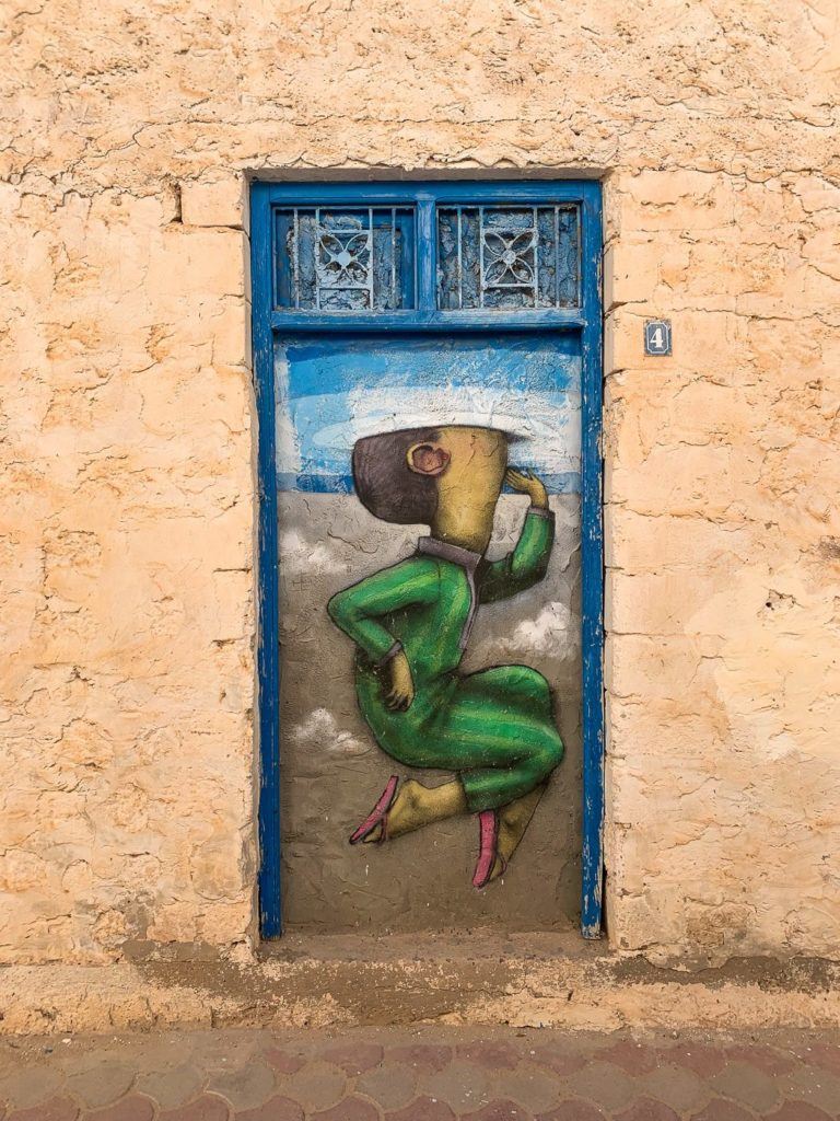 a door with a painting of a woman on it.