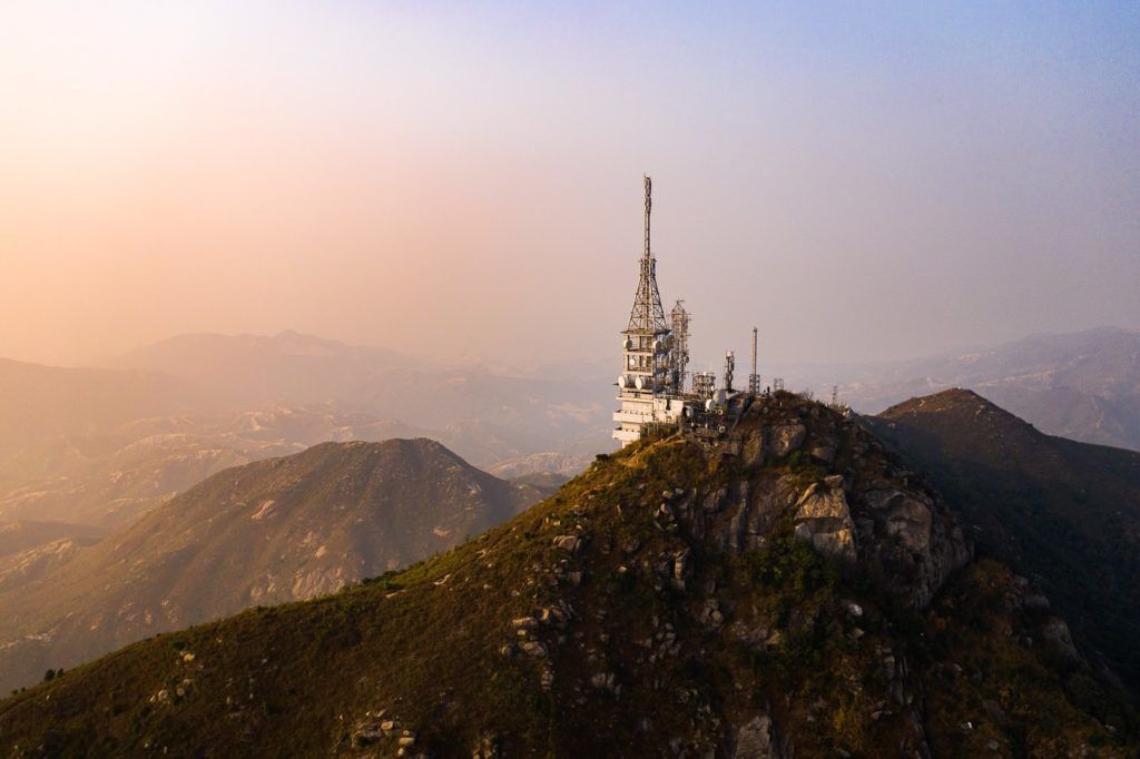 a very tall tower on top of a mountain.
