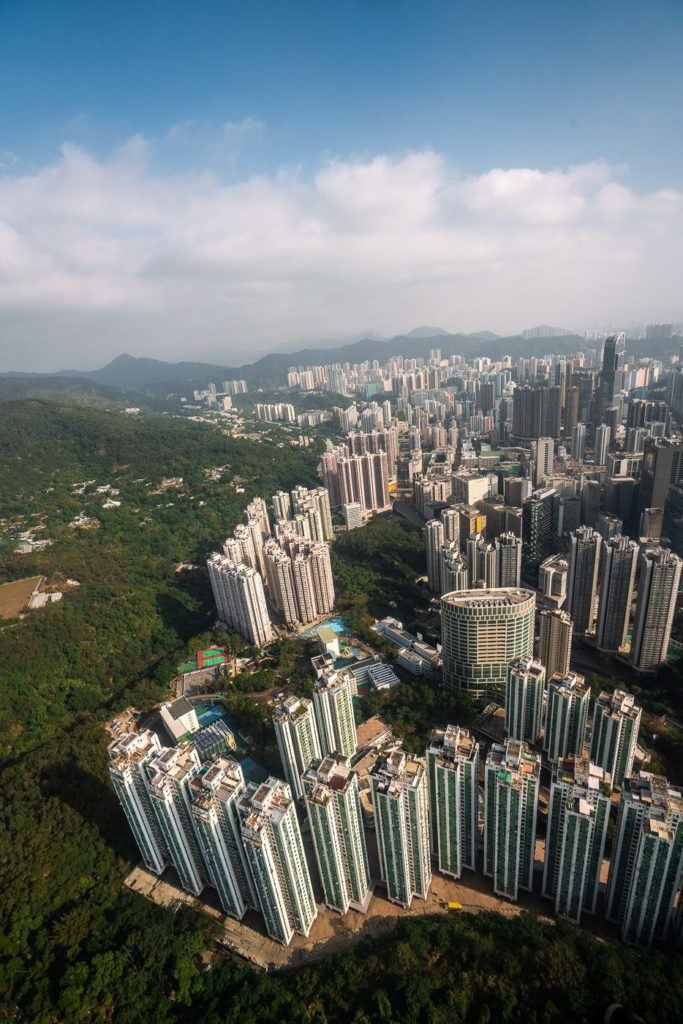an aerial view of a city with tall buildings.