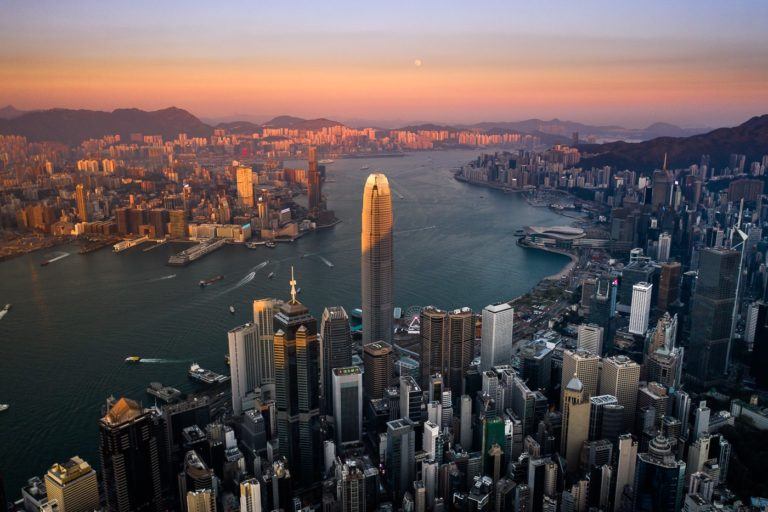 a view of a city from the air at sunset.