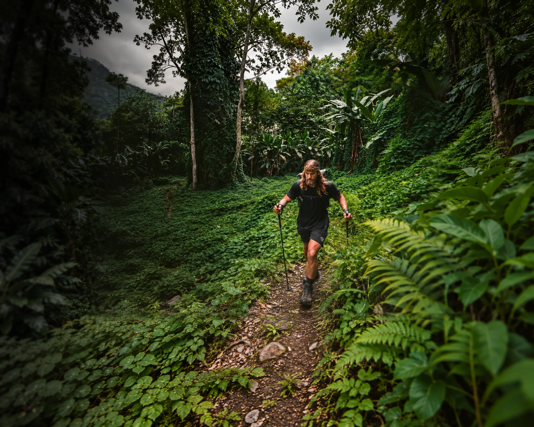 Jackson Groves hiking a jungle trail