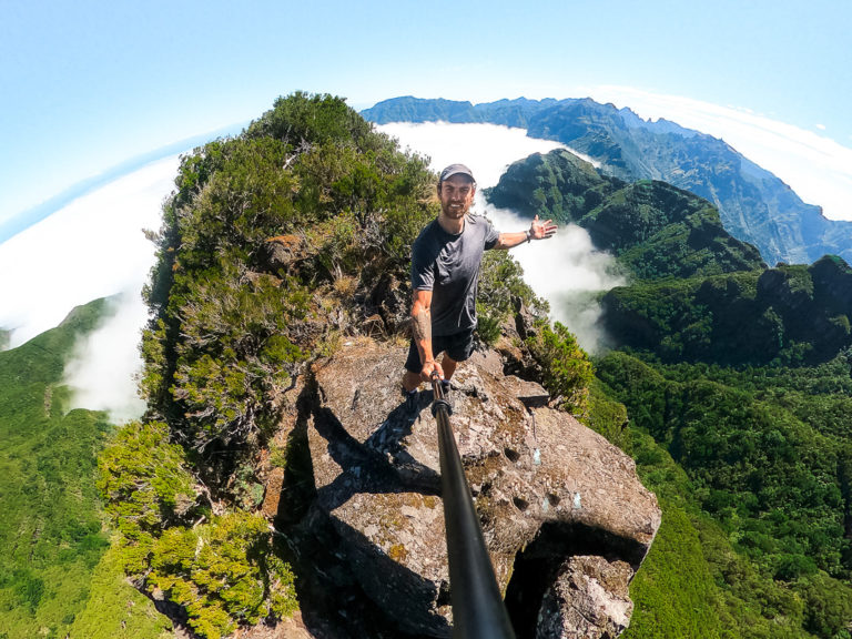 a man standing on top of a mountain.