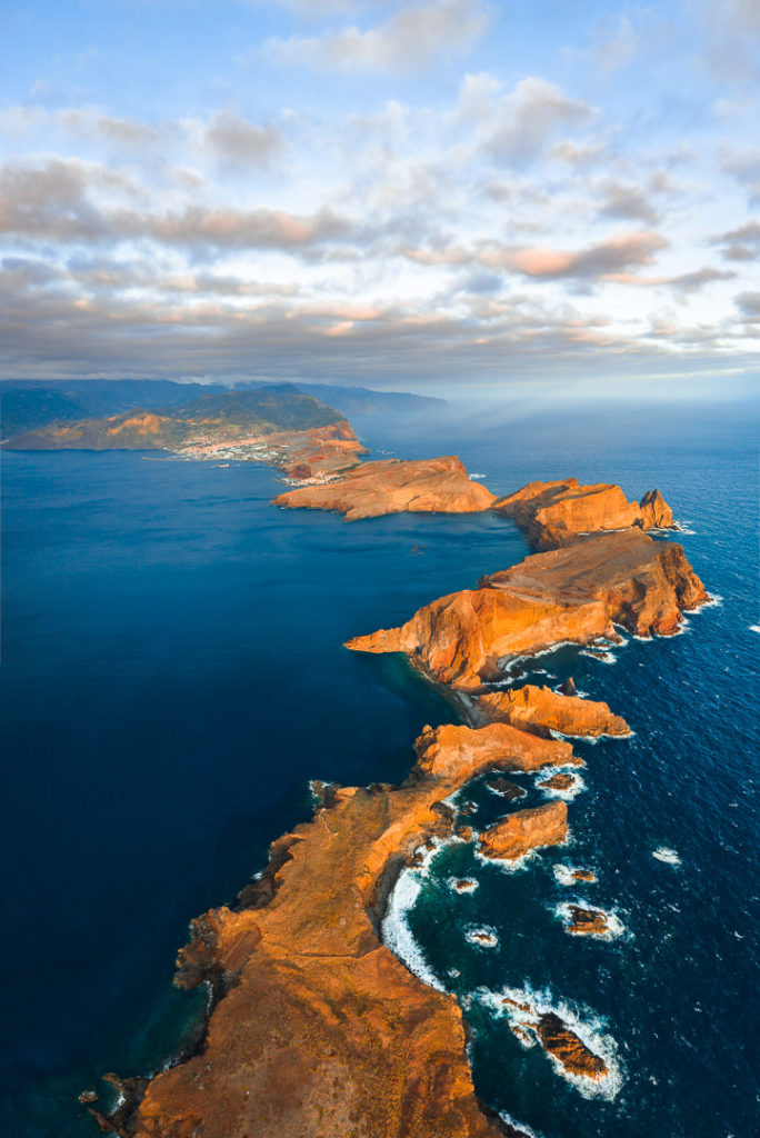 an aerial view of the ocean and land.