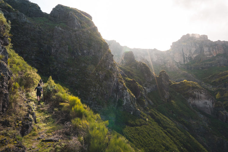 a person walking up a steep mountain side.