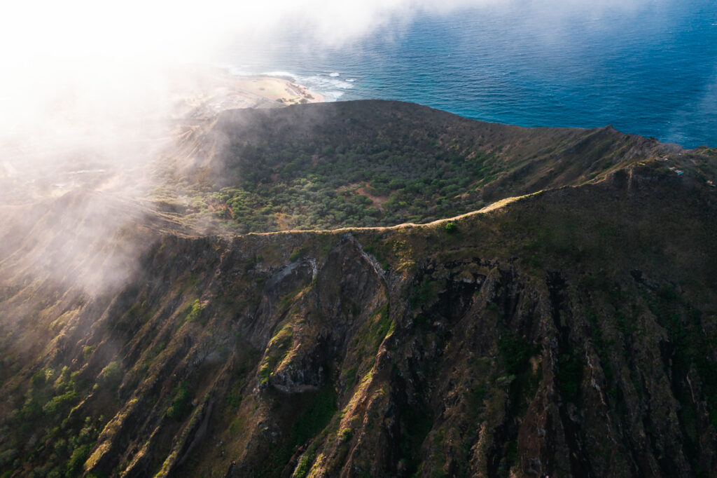 an aerial view of a road on a mountain