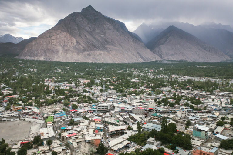 a view of a city with mountains in the background