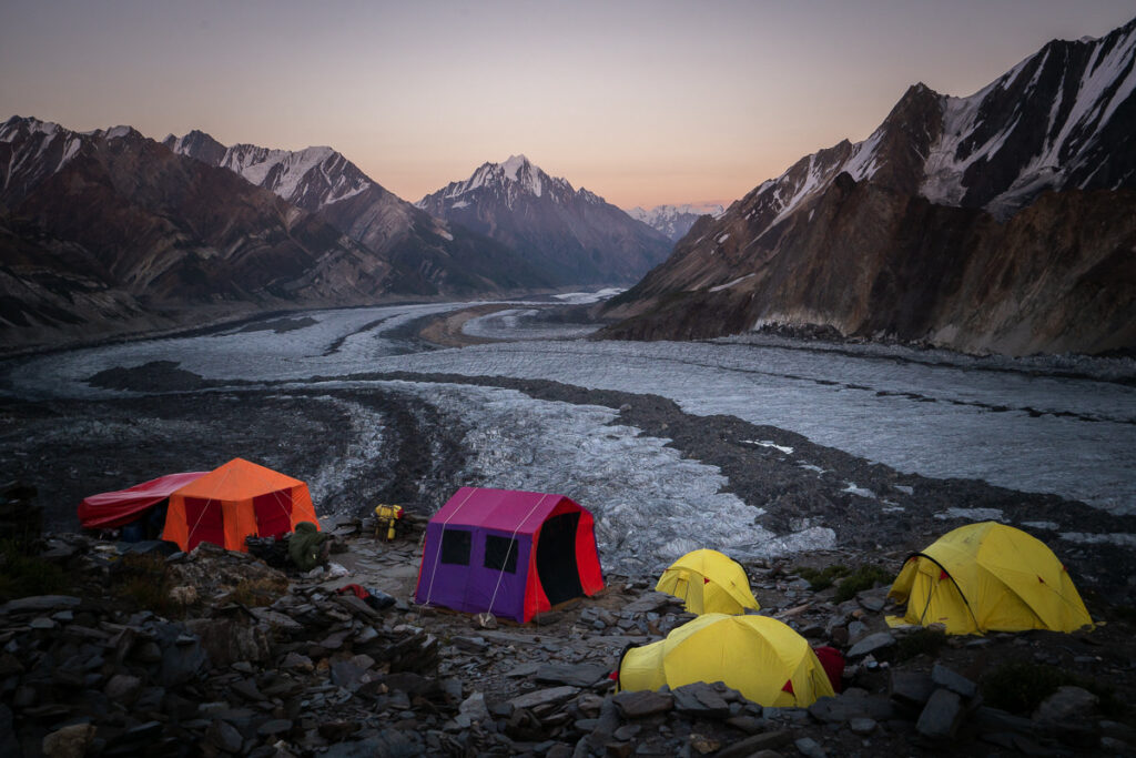 a group of tents sitting on top of a rocky hillside