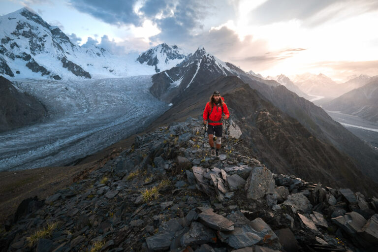 a man standing on top of a rocky mountain