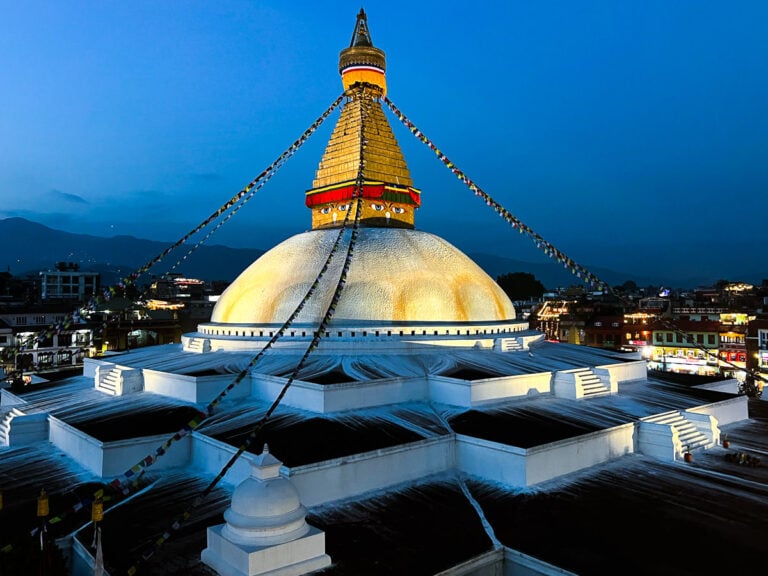 a large white building with a golden dome on top of it