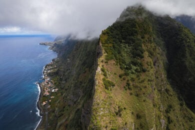 a view of a mountain with a body of water below it