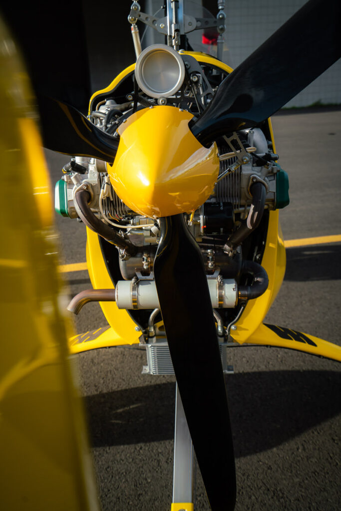 a close up of a yellow and black propeller.