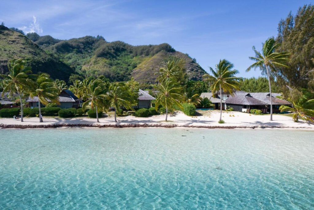 A tropical island with white sand and palm trees, perfect for resorts in Moorea.