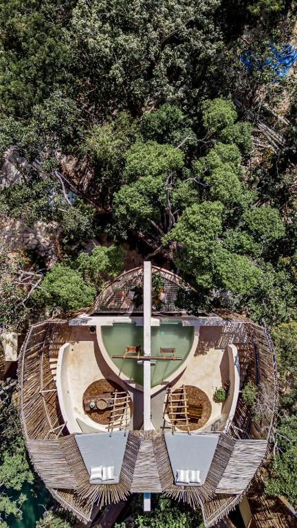 An aerial view of a tree house in the jungle.