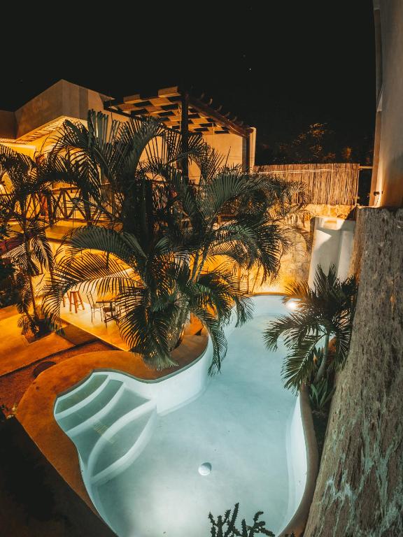 A pool at night at a house in mexico.