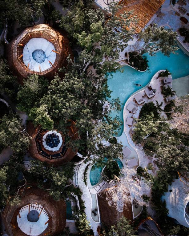 An aerial view of a resort surrounded by trees.