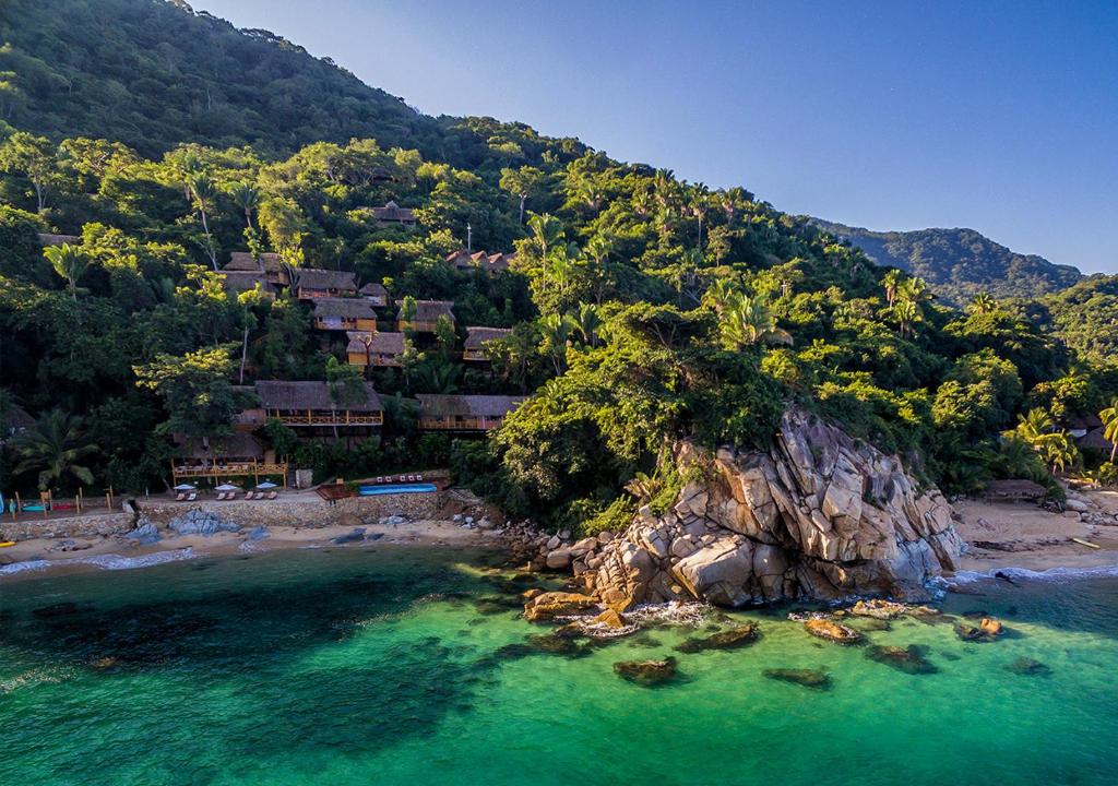 An aerial view of a resort on the coast of mexico.