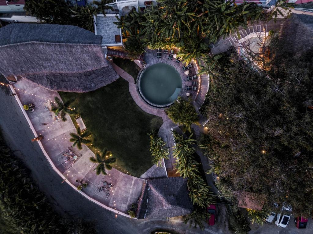 An aerial view of a pool at dusk.